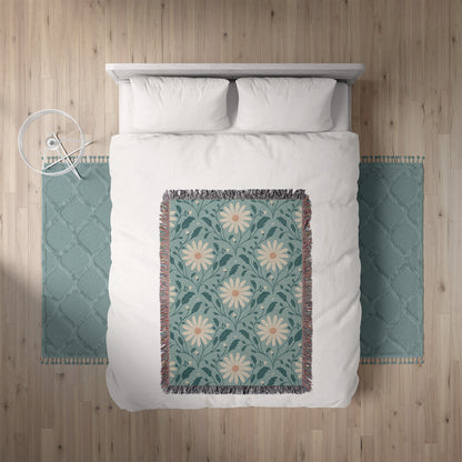 Bed with white bedding and a floral throw blanket