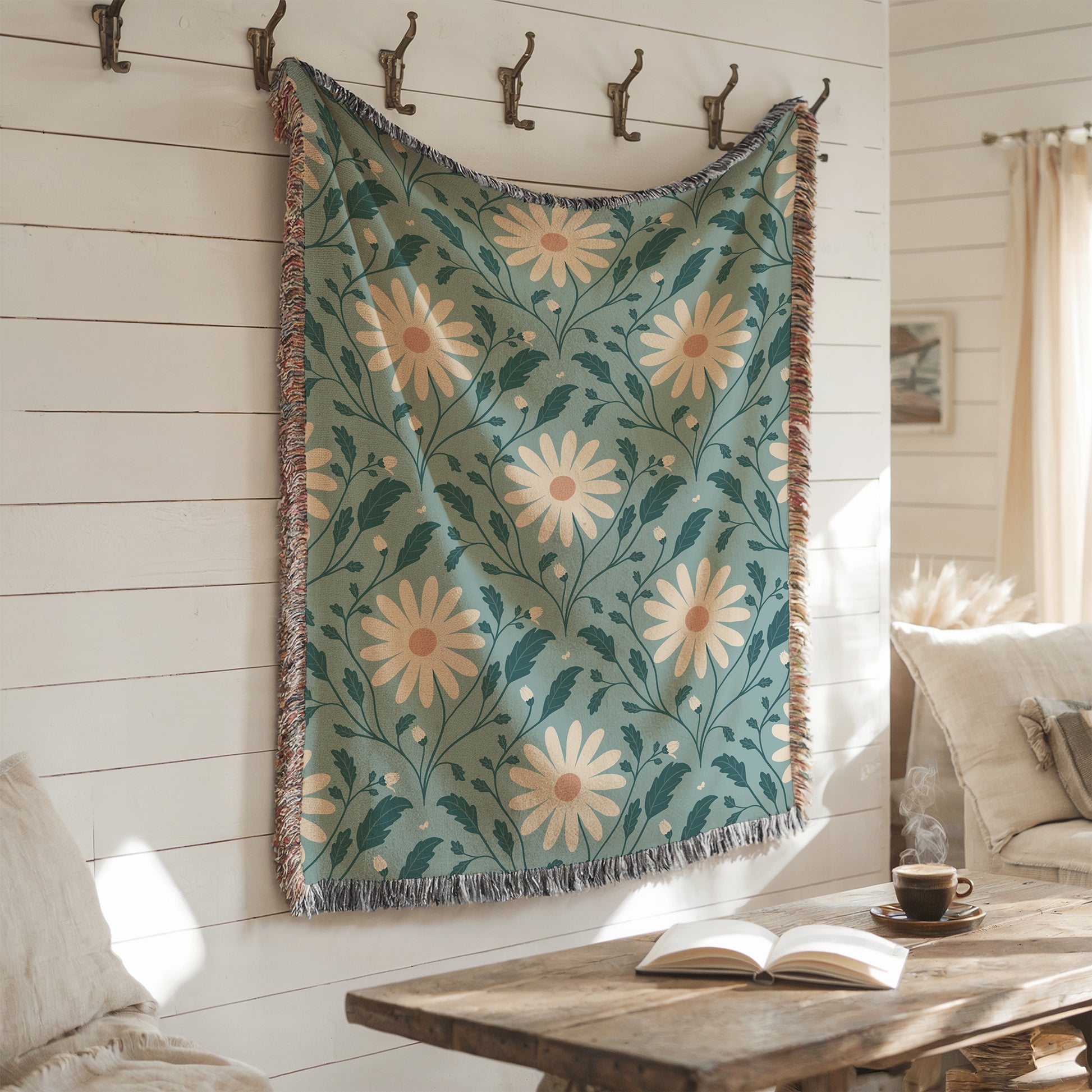 Floral patterned throw blanket hanging on a wall with a cozy living room setting.