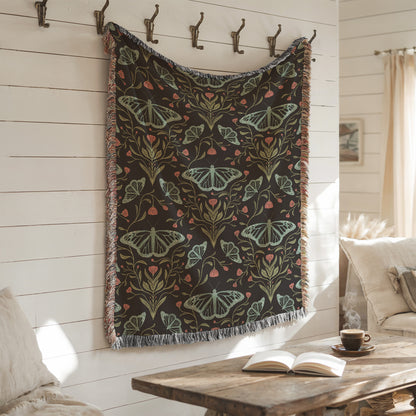 Decorative blanket with butterfly pattern hanging on a wall in a cozy room.