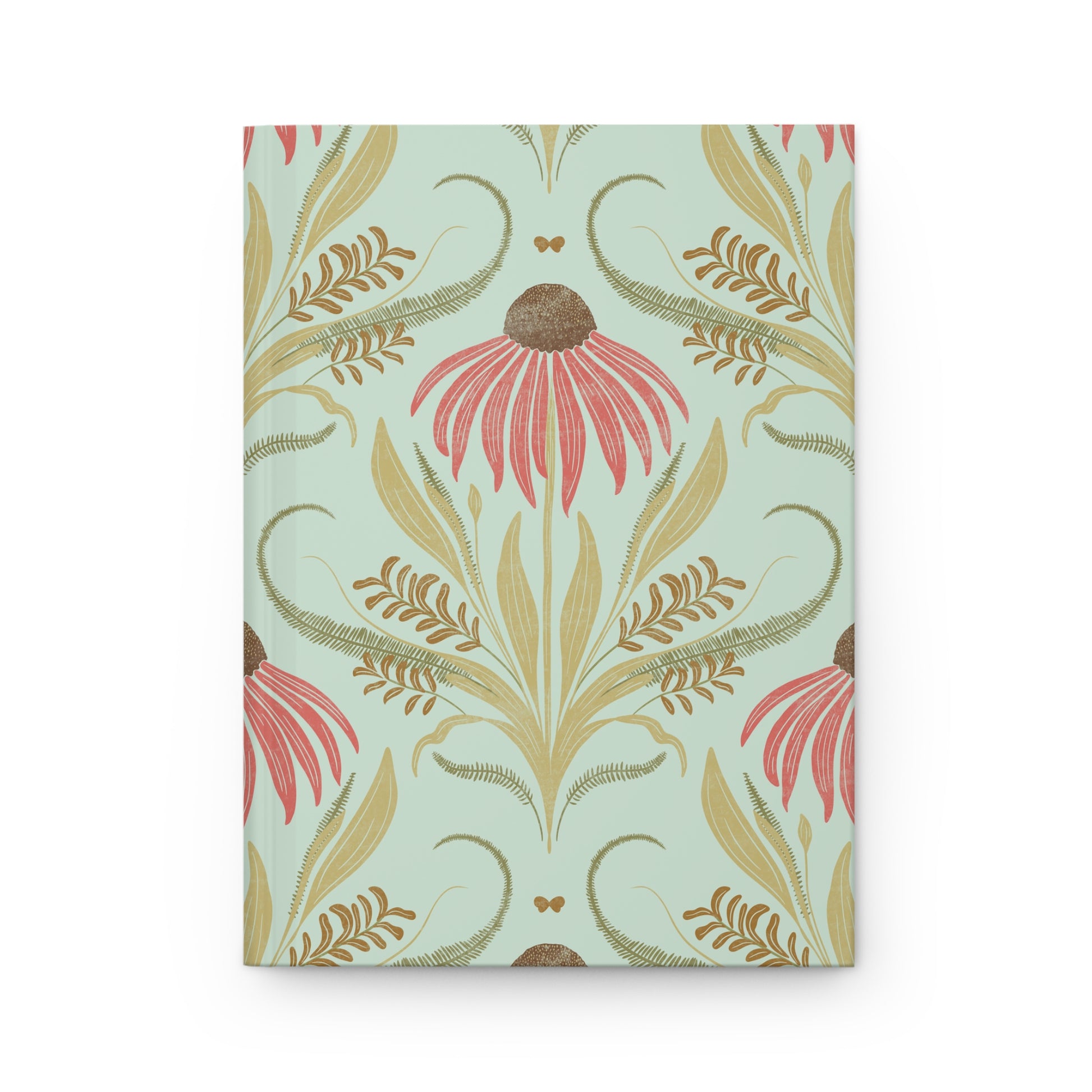 Floral patterned notebook with pink and gold design on a light blue background