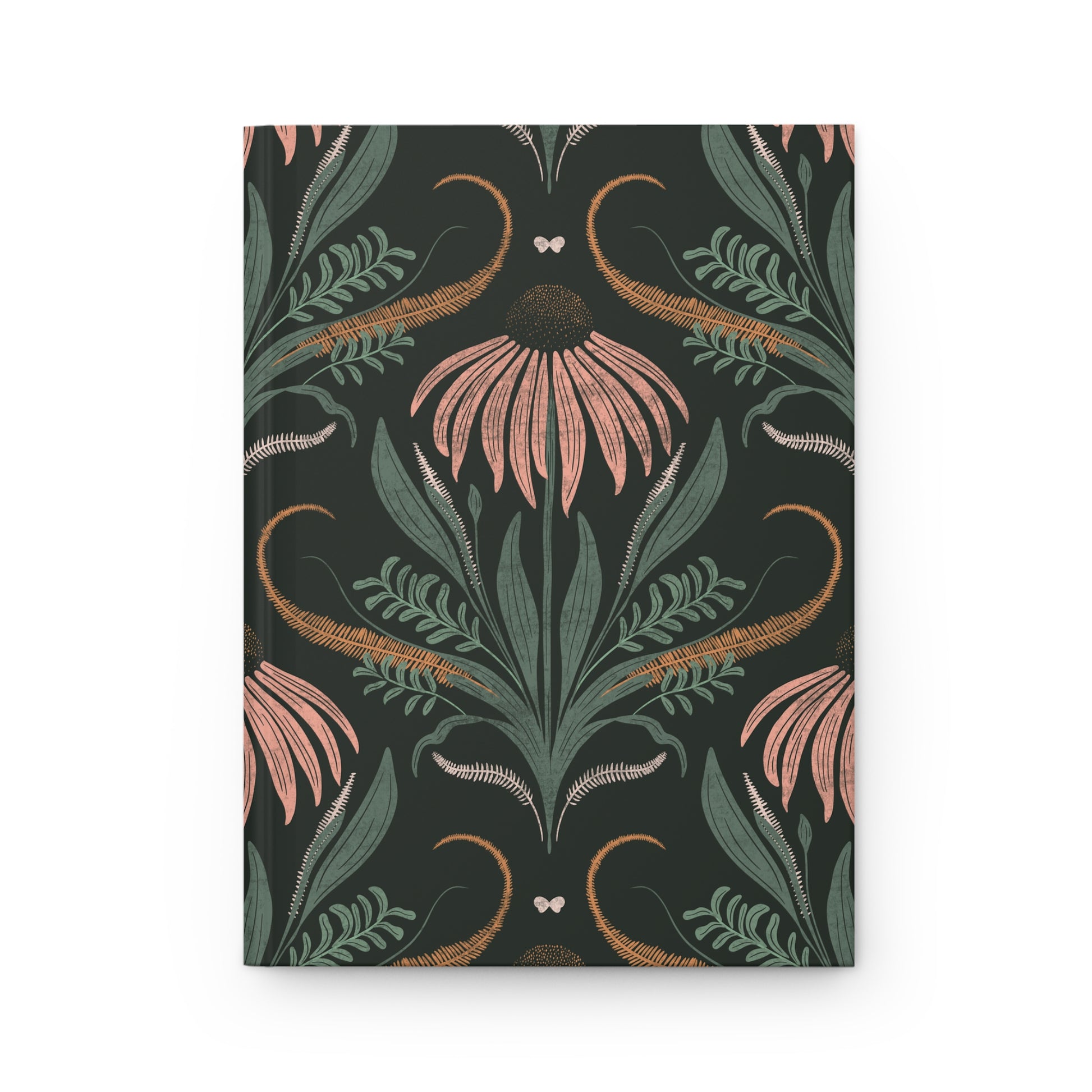 Notebook with floral and leaf pattern on a dark background