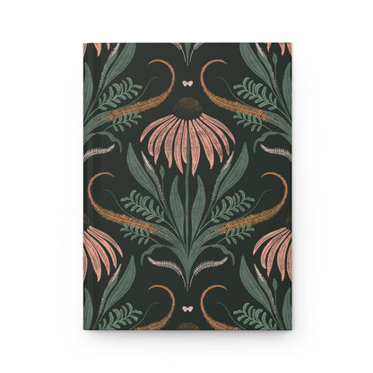 Notebook with floral and leaf pattern on a dark background