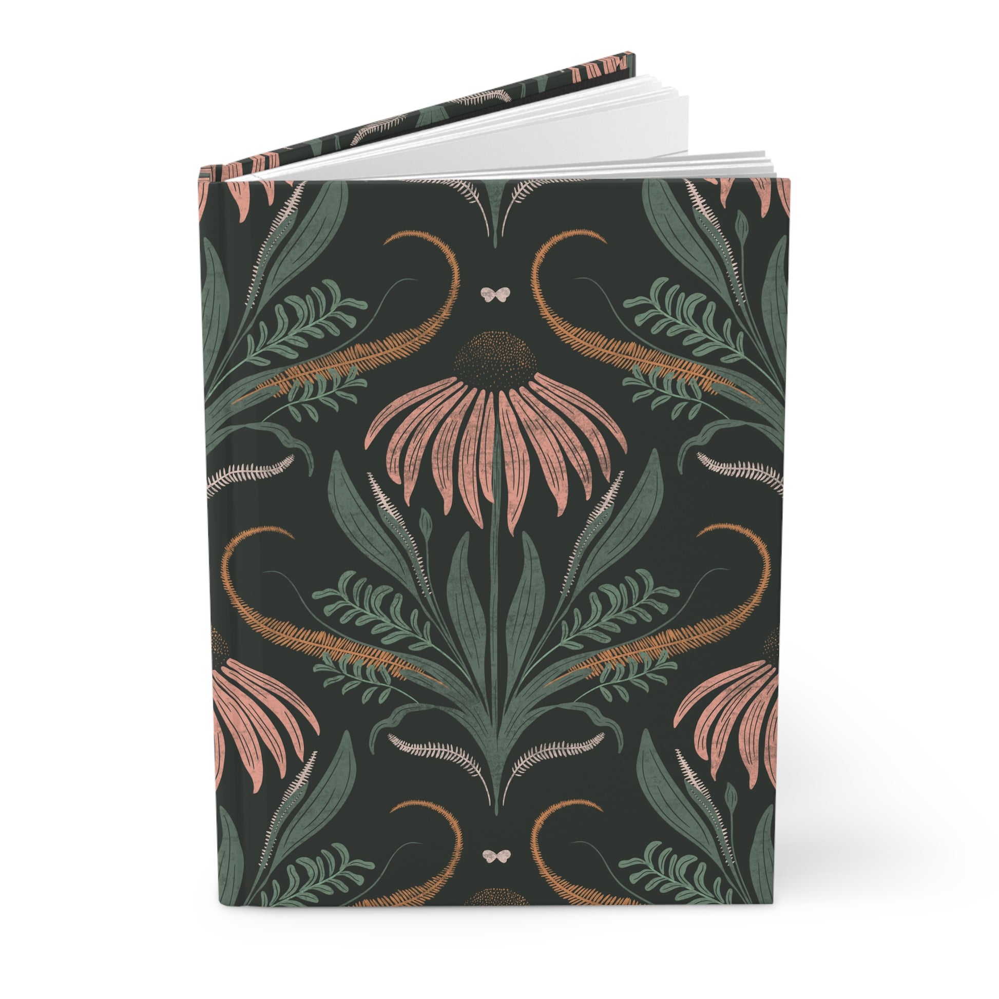 Notebook with floral and leaf pattern on a dark background